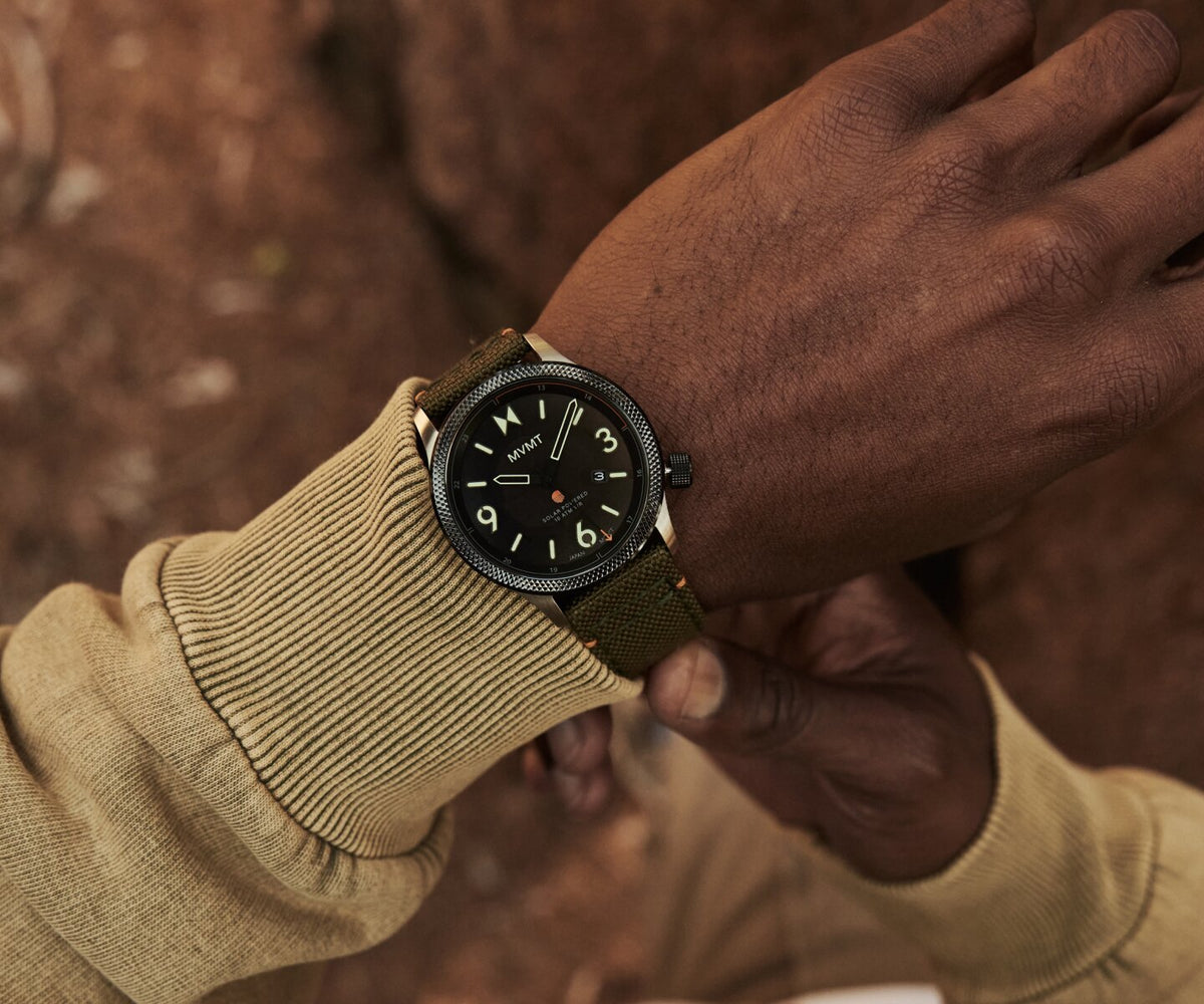 Man in a beige sweater wearing the Field II  solar men's watch