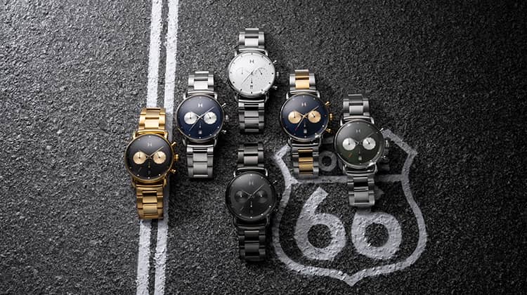 Six Blacktop II watches laying on the road.