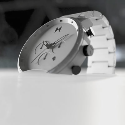 White Chrono Ceramic watch floating up from white liquid.
